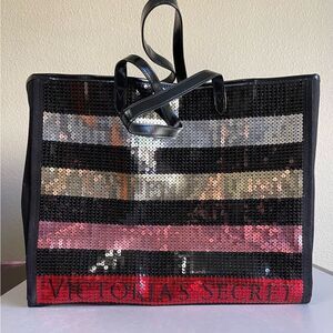 EUC. Beautiful Black/Sequin striped Victoria’s Secret Tote.